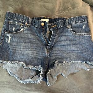 Dark wash distressed denim shorts size 14, no stains or extra tears.
